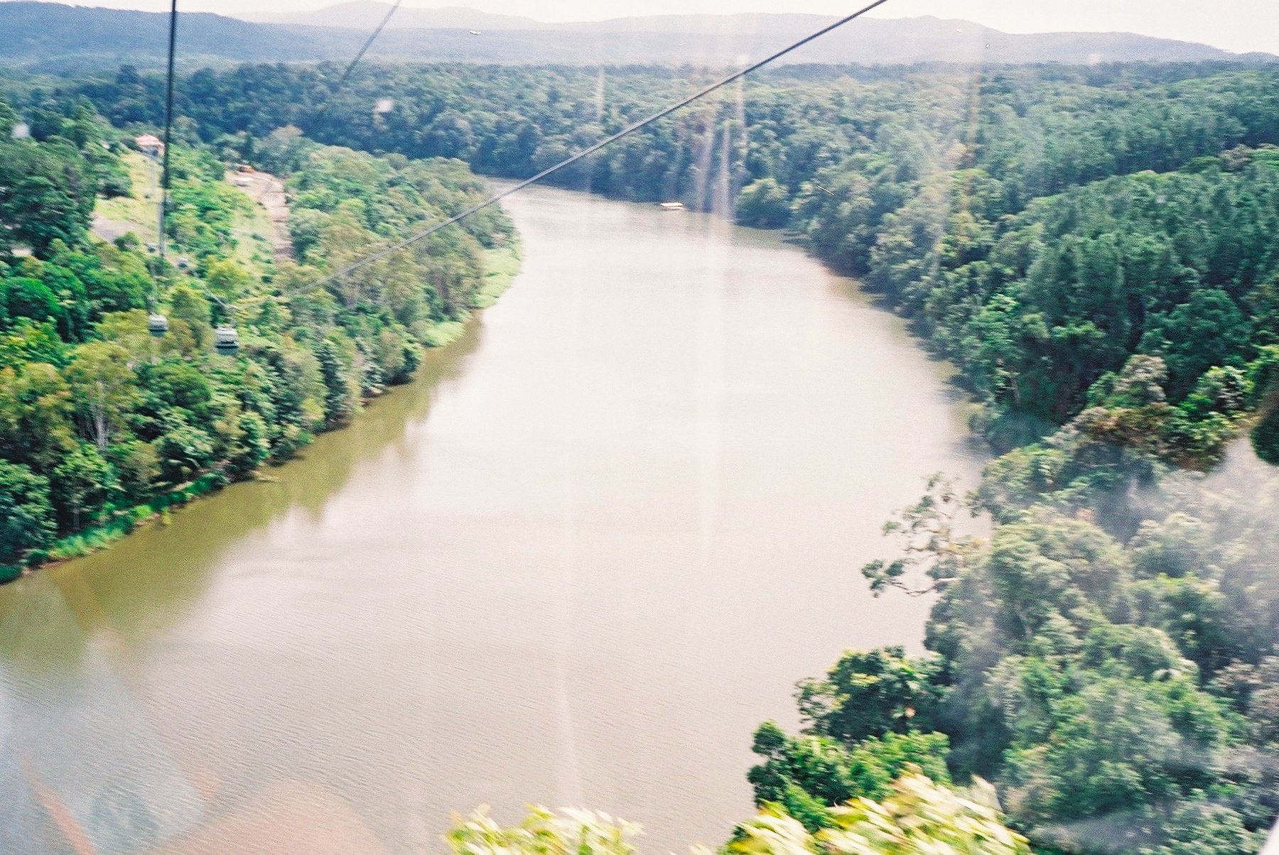 View across a river in the Kuranda rainforest, from high up in a cable car.