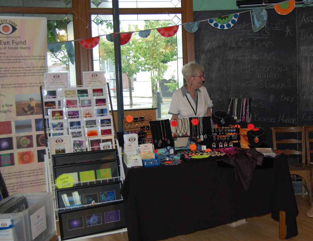 Carol behind the stall at the Craft Fair at Hope Place.