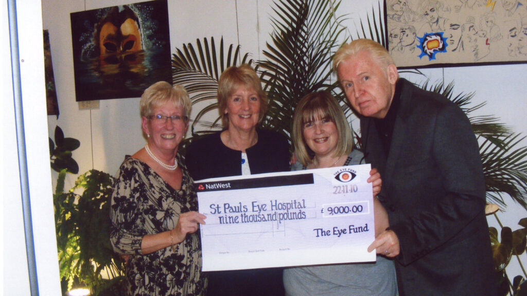 Eye Fund Chair, Carol Sherry, and Patron, Mike McCartney, present a cheque to St. Paul’s Eye Hospital.