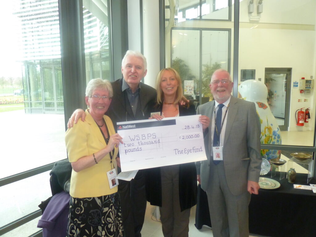 Carol, Paul, and Mike present a cheque to Lyn from WSPB.