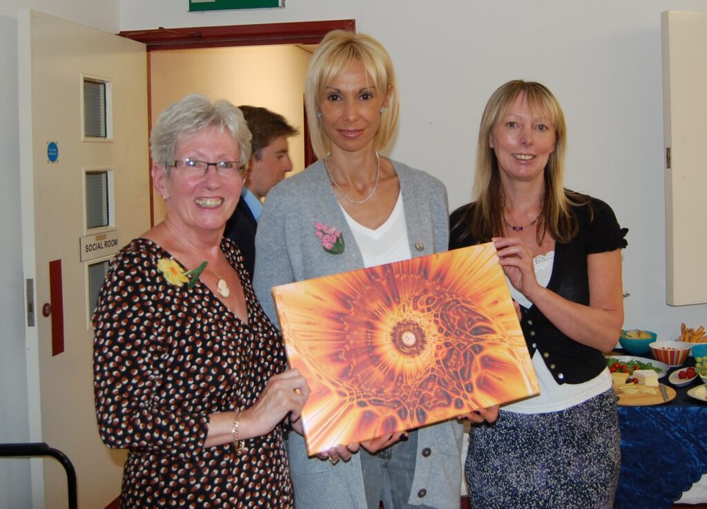 Montse Benitez accepting a print from Carol Sherry and Lyn Sedgwick - June 2012.